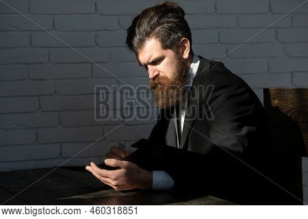 Portrait Of A Teacher Or Professor At Classroom. Satisfied Serious Mature Teacher. Mature Professor,