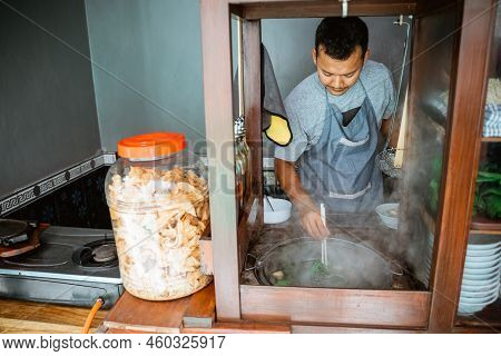 The Seller Boils The Vegetables While Preparing The Dish