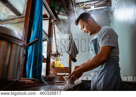 Close Up Of Seller Prepares Of Chicken Noodles