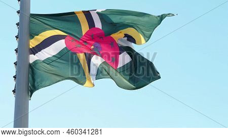 Dominika, Flag Is Fluttering In The Wind Photo On The Background Of The Sky, Outdoors. National Flag