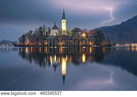 Astonishing Night  View Of Popular Tourist Destination  Bled Lake. Dramatic View Of Pilgrimage Churc