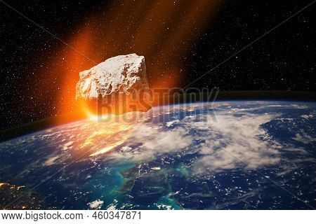 Planet Earth And Big Asteroid In The Space. Potentially Hazardous Asteroids. Asteroid In Outer Space