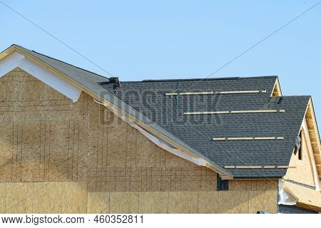 Edge Of Roof Shingles On Top Of The House, Dark Asphalt Tiles On The Roof Grey Rooftop