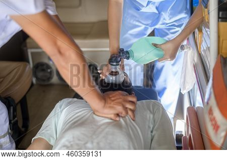Group Of Rescue Emergency Team Transporting Patient From Emergency Car  Through Hospital Corridors.