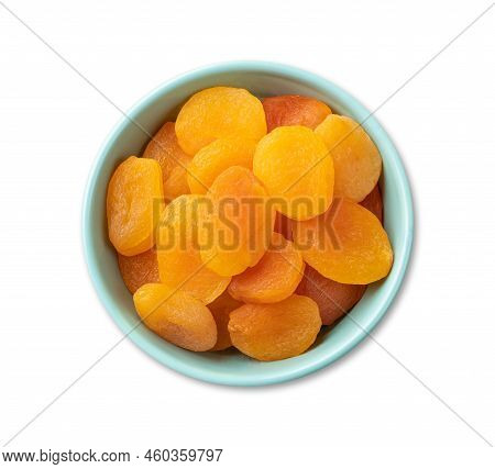 Dried Apricots In A Bowl Isolated Over White Background.