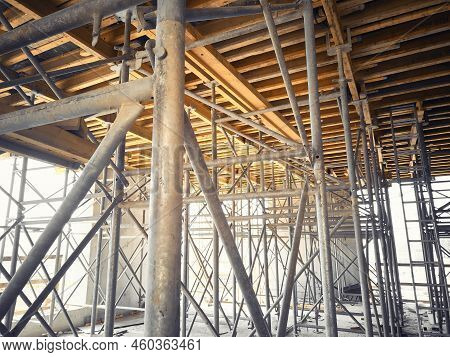 Framework Of Metal Scaffolding Support Yellow Formwork Beams Of Floor Slab. Supporting Structures At