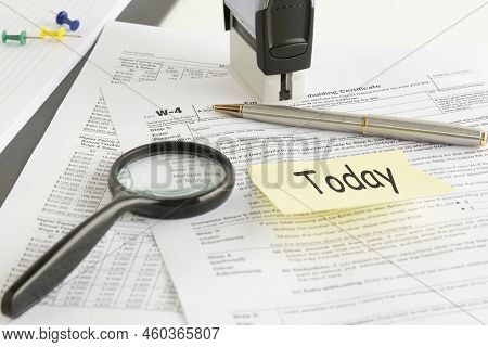 Blank W4 Tax Form, Magnifying Glass And A Pen On Table, Tax Season, Business Concept