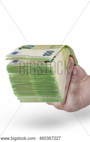 Stack Of Money In Hand Isolated On White Background. 100 Euro Banknotes In A Mans Hand. A Man Holds 