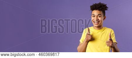 Believe In You. Portrait Of Cheerful Young Optimistic Guy Encuraging To Keep Going, Pointing Fingers
