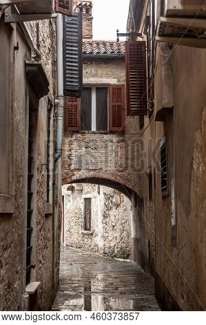 Typical Mediterranean Old Narrow Street With Southern European Architecture, With Ancient Buildings,