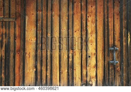 Wooden Wall Under A Blue Sky In Summer