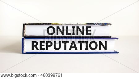 Online Reputation Symbol. Books With Concept Words Online Reputation On Beautiful White Background. 