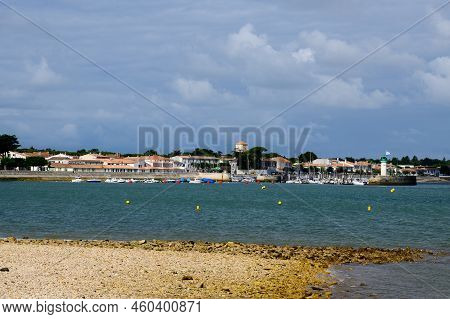 View On The Phare De La Flotte And Some Boats On The Sea From The Beach Plage De L' Arnérault On A S