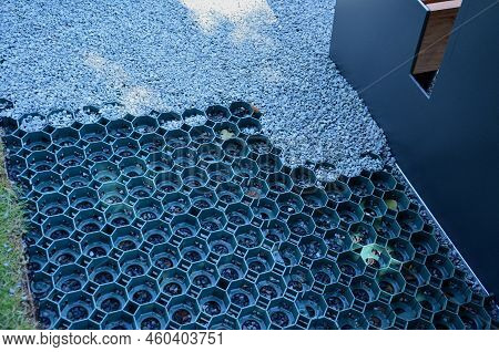 Installation Of A Plastic Mat As A Substitute For Lawn. Plastic Permeable Tiles Are Filled With A Fi