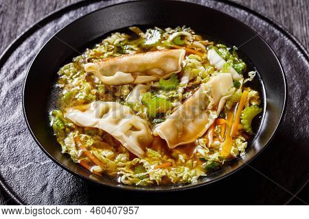 Asian Potsticker Gyoza Soup With Dumpling Of Ground Chicken, Napa Cabbage, Scallions, Ginger,  Celer