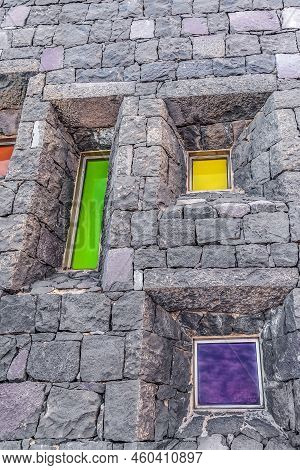Santa Cruz De Tenerife, Spain - November 24, 2021: Several Bright Color Glasses In The Stone Wall Of