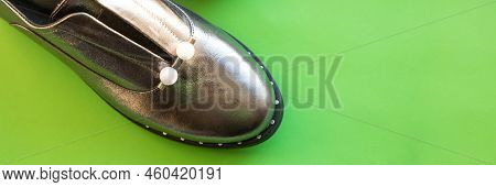 Studio Shot Of Silver Autumn Boots, Isolated On Green Background.fashionable Trendy Leather Womens H