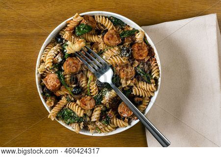 Rotini Pasta  Served With Sauteed Spinach And Italian Sausage
