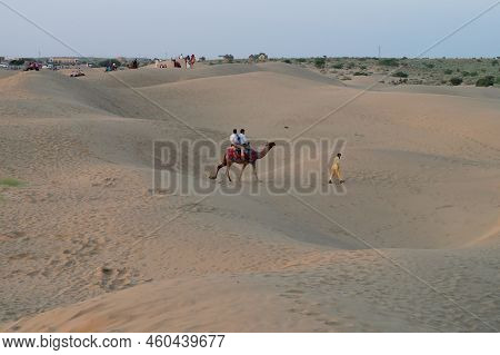 Tourists Riding Camels, Camelus Dromedarius, At Sand Dunes Of Thar Desert, Rajasthan, India. Camel R