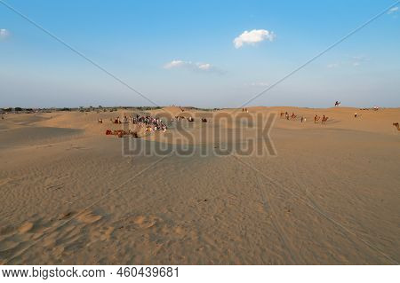 Tourists With Camels, Camelus Dromedarius, At Sand Dunes Of Thar Desert, Rajasthan, India. Camel Rid