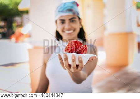 Close Up Of Young Woman Holding A Shaved Ice In The Street. Concept Of A Girl With A Nicaraguan Rasp