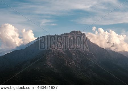 Evening Sunlight On The Craggy 2389 Metre High Mountain Peak Of Monte Padro In Corsica