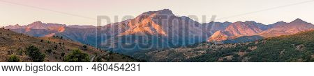 Panoramic View Of Sunrise Over The 2389 Metre Peak Of Monte Padro And Surrounding Mountains In The B
