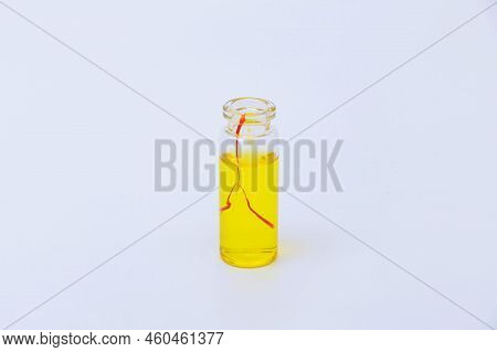 Saffron Drink In A Small Jar On A White Background.