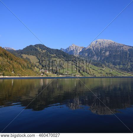 Mountain Landscape Reflecting In Lake Waegital. Schwyz Canton.
