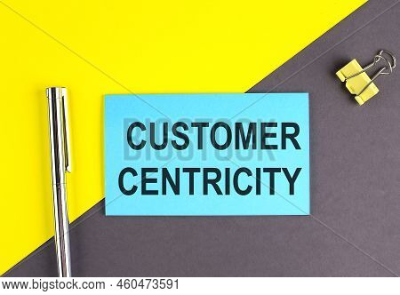 Customer Centricity Text Written On A Sticky With Pen On Grey, Yellow Background, Business Concept