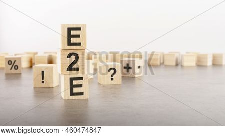 E2e Text As A Symbol On Cube Wooden Blocks. Many Wooden Blocks With Symbol In The Background. E2e - 