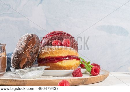 Bolas De Berlim, Or Berlin Balls. Portuguese Fried Dough With Sugar, Filled With Chocolate Or Raspbe