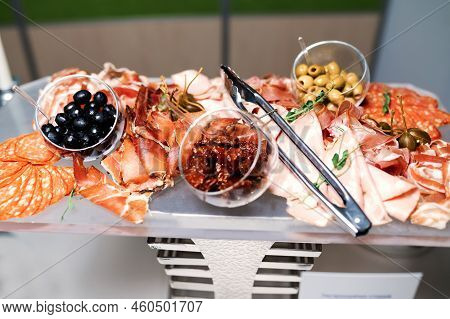 Plate With Meat, Salami, Ham, Backon, Prosciutto On Dark Grey Black Slate Background