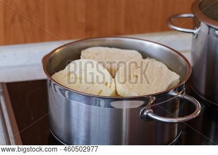 Czech Yeast Dumpling Sliced Into Wheels And Put Into A Steaming Pot To Keep The Dumpling Hot
