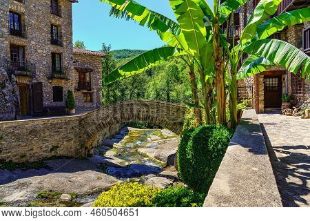 Bridge Made Of Stone And Small Stream That Passes Through The Mountain Village Of Beget, Girona, Spa