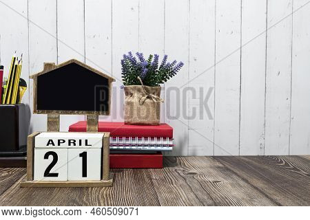 April 21 Calendar Date Text On White Wooden Block On Wooden Desk.