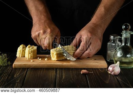 Chef Cuts Boiled Corn Kernels With A Knife. Maize Is An Excellent Dietary Breakfast Or Lunch By The 