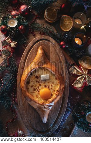 Traditional Georgian Adjarian Khachapuri With Suluguni Cheese, Egg Yolk, Butter