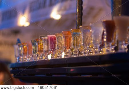 Glass Stacks Are Filled With Different Drinks As An Advertisement In A Drinking Establishment, A Bar