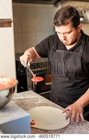 Latin Pizzeria Chef Cook Pizza In Professional Uniform. Restaurant Italian Cuisine Entrepreneur
