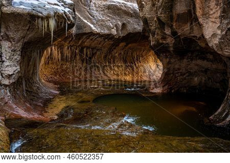 Rounded Walls Of The Subway Are Covered In Icicles In Zion National Park