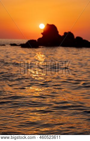 Beautiful View Of Orange Sunset Seascape With Rocks In Italy. Tropical Colourful Sunrise Landscape. 
