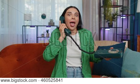 Crazy Adult Girl In Casual Shirt Talking On Wired Vintage Old-fashioned Retro Telephone Of 80s, Fool