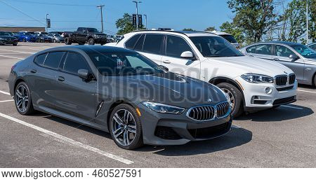 Monroeville, Pennsylvania, Usa August 28, 2022 A Used Bmw Sedan And An Suv For Sale At A Dealership 
