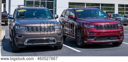 Monroeville, Pennsylvania, Usa August 28, 2022 Two Jeep Suvs For Sale At A Dealership On A Sunny Sum