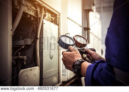 Heat And Air Conditioning, Hvac System Service Technician Using Measuring Manifold Gauge Checking Re