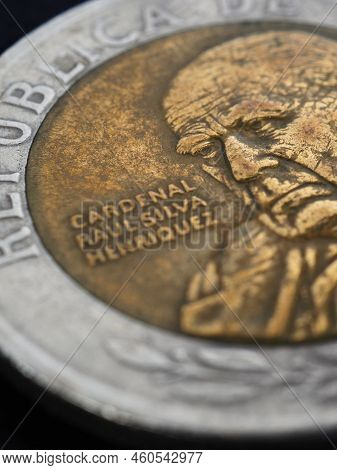 Translation: Republic Of Chile. Coin Of 500 Chilean Pesos Close-up. Peso Of Chile. News About Econom