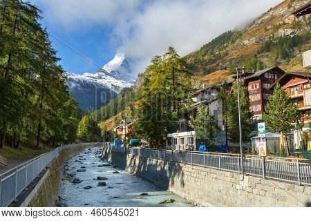 Zermatt, Switzerland - October 7, 2019: Town Street View In Famous Swiss Alps Ski Resort, River, Mat