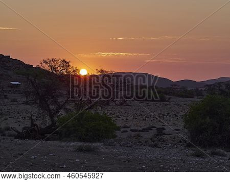 Sunset Over The Arid Landscape Of The Kaokoveld Near The Skeleton Coast In Namibia Africa