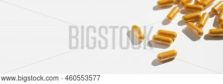 Turmeric Plus Black Pepper Extract Gelatin Capsule Close Up Top View. Herbal Supplement Organic Curc